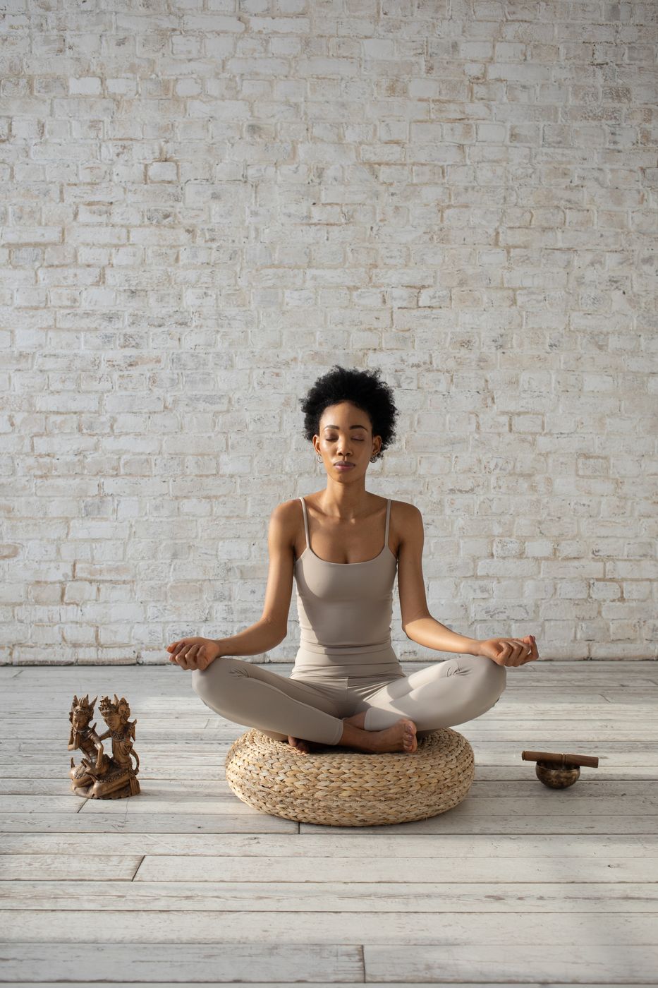Woman meditating peacefully at home